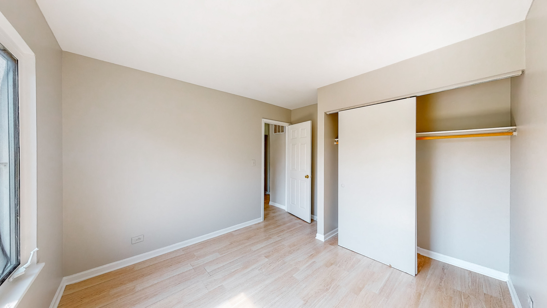 20 Elm Court, Unit 3 Bolingbrook, IL 60440 - Photo 20 of 21 a view of an empty room with wooden floor and a window