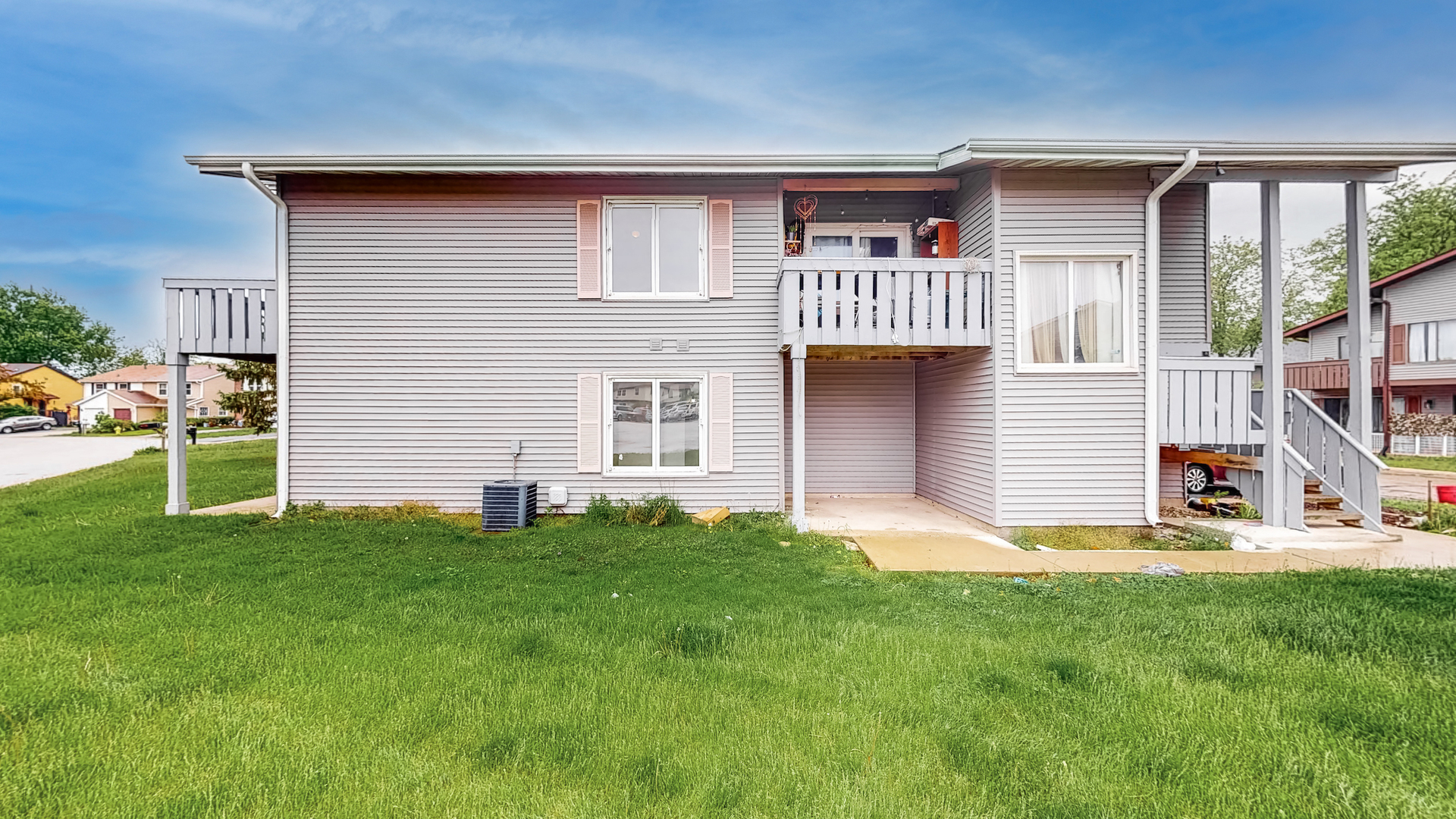 20 Elm Court, Unit 3 Bolingbrook, IL 60440 - Photo 2 of 21 a front view of a house with a yard