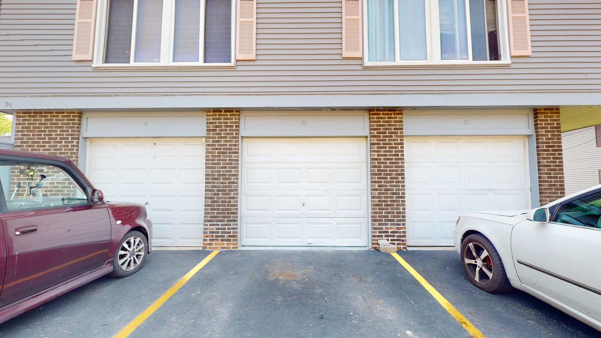 20 Elm Court, Unit 3 Bolingbrook, IL 60440 - Photo 6 of 21 a view of a car in front of a house