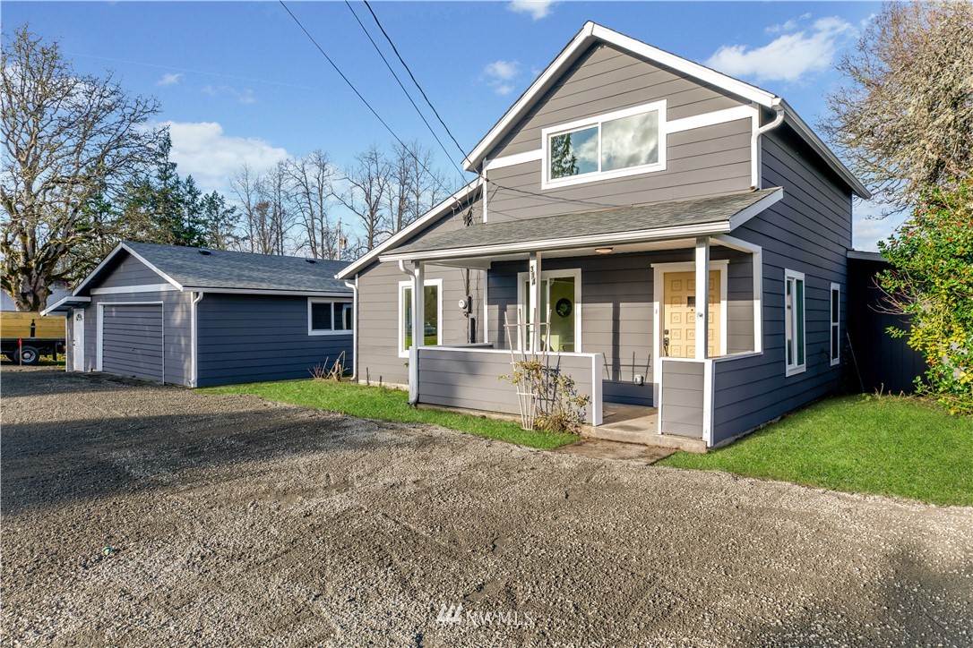 314 3rd Street Roy, WA 98580 - Photo 1 of 30 a front view of a house with a yard and garage