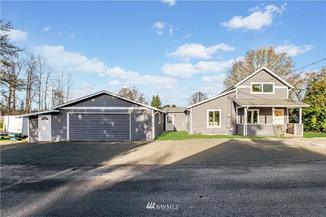 314 3rd Street Roy, WA 98580 - Photo 2 of 30 a front view of a house with a yard