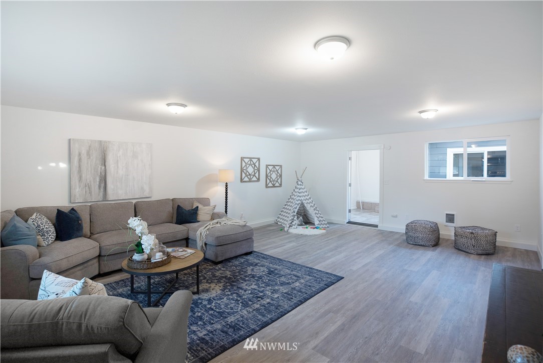 314 3rd Street Roy, WA 98580 - Photo 15 of 30 a living room with furniture and a wooden floor