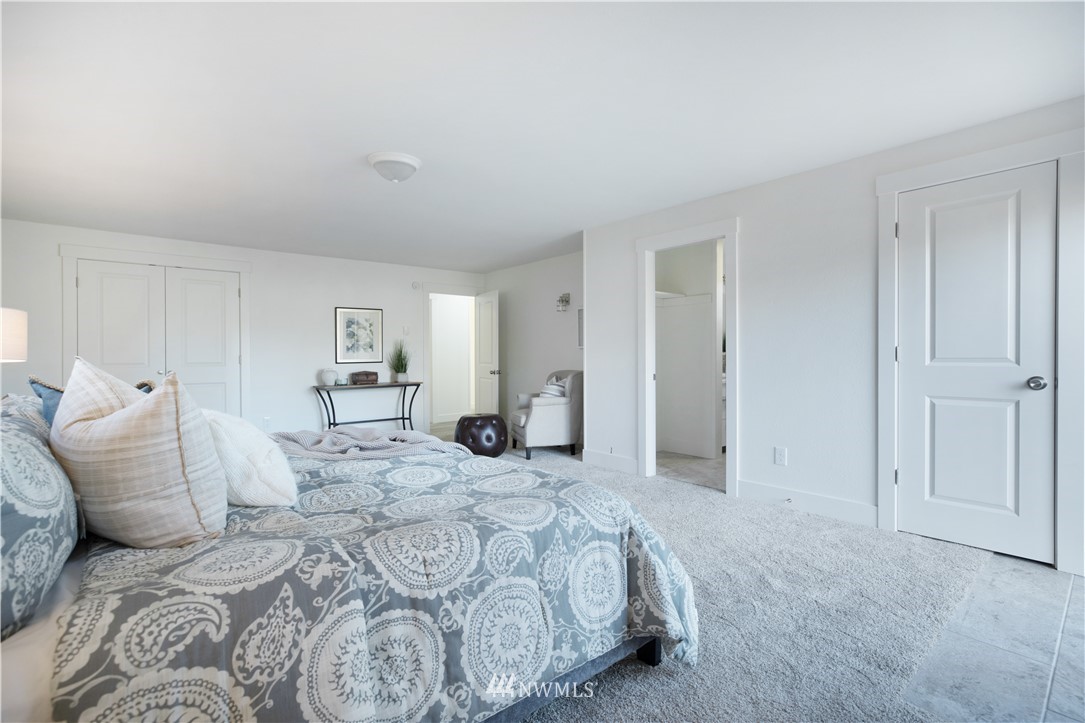314 3rd Street Roy, WA 98580 - Photo 16 of 30 a bedroom with a bed and a couch