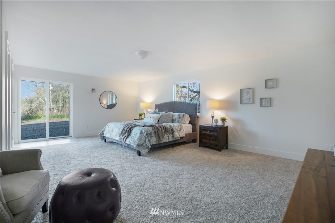 314 3rd Street Roy, WA 98580 - Photo 17 of 30 a bedroom with bed and a large window