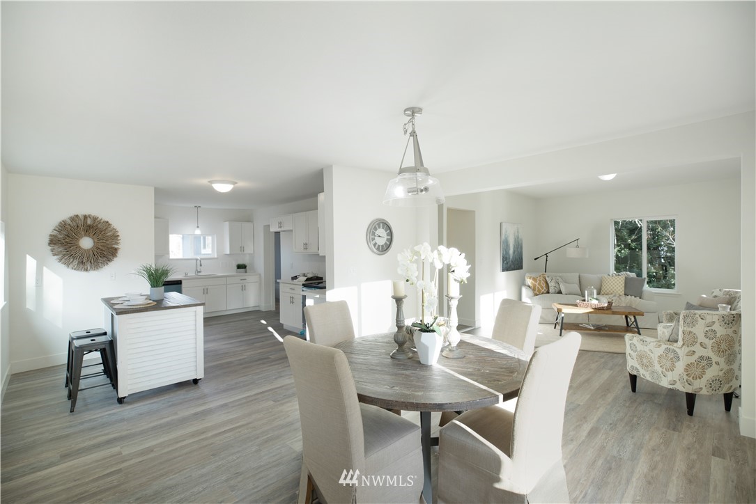 314 3rd Street Roy, WA 98580 - Photo 6 of 30 a view of a dining room with furniture and wooden floor