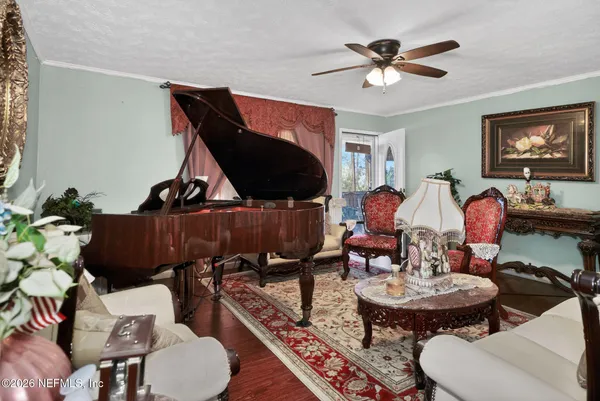 a bedroom with a bed next to a window