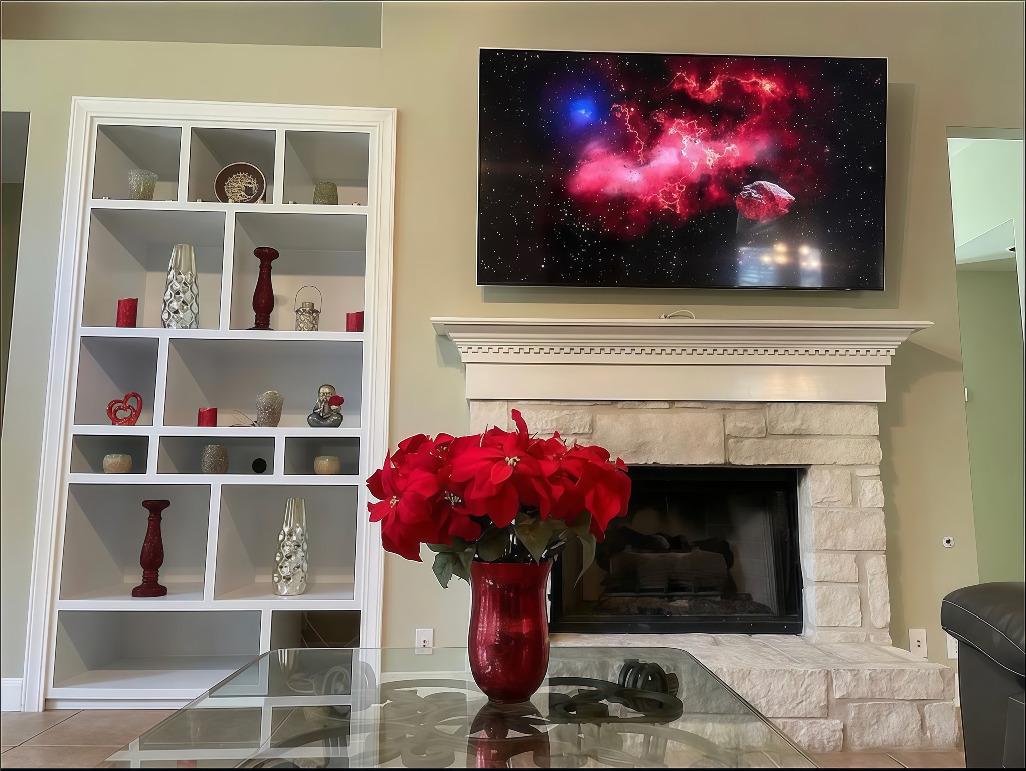 12616 Alberta Ridge Trail Austin, TX 78726 - Photo 21 of 26 An elegant stone fireplace stands adjacent to tall, custom built-in shelving.
