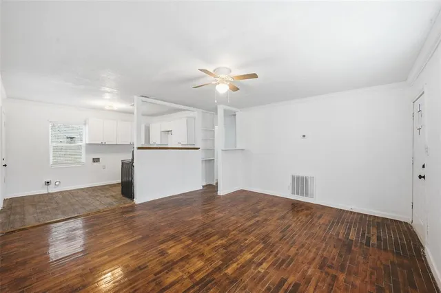 a view of kitchen with granite countertop cabinets and wooden floor