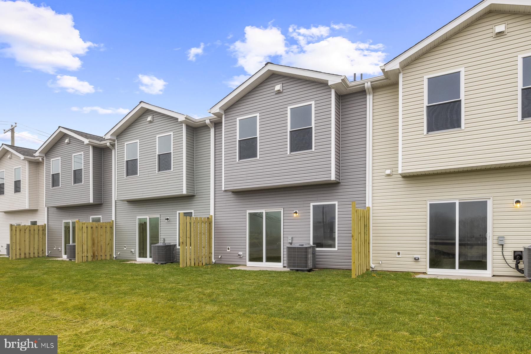 8126 Bartholomew Court Baltimore, MD 21206 - Photo 2 of 14 a big house with a big yard and large trees