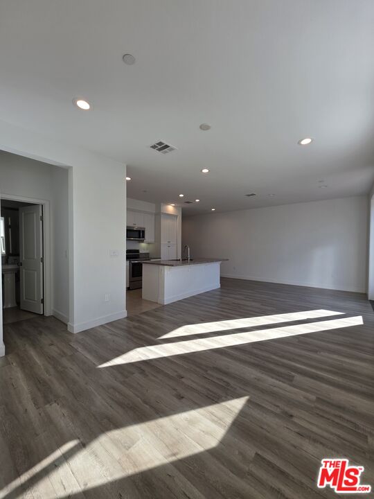 5308 Harvard Way Cypress, CA 90630 - Photo 5 of 17 a view of kitchen with kitchen island sink and refrigerator