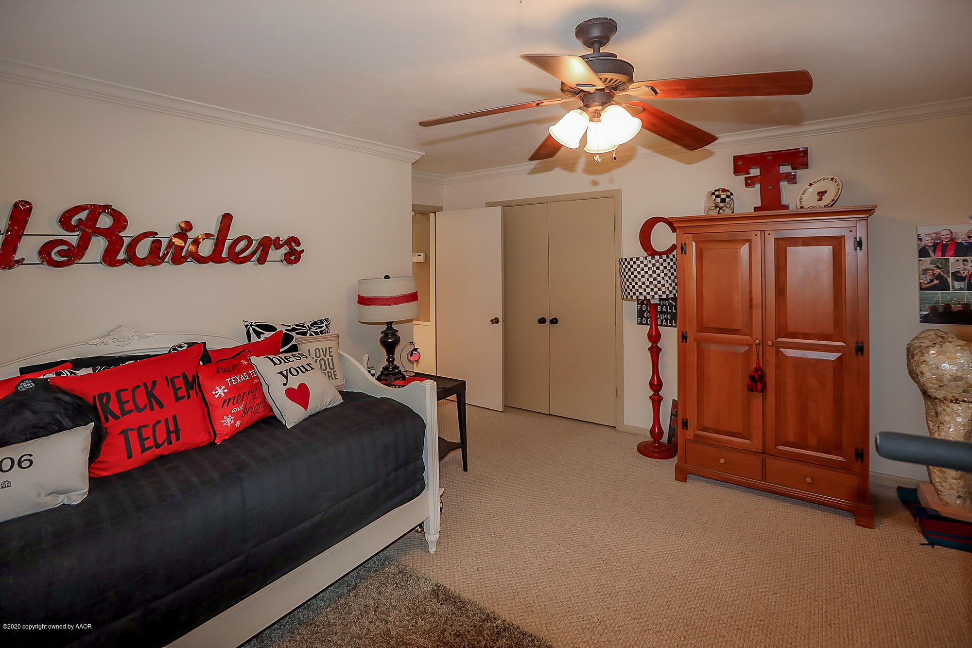 6012 Gainsborough Road Amarillo, TX 79106 - Photo 12 of 15 a bedroom with a bed and a chandelier