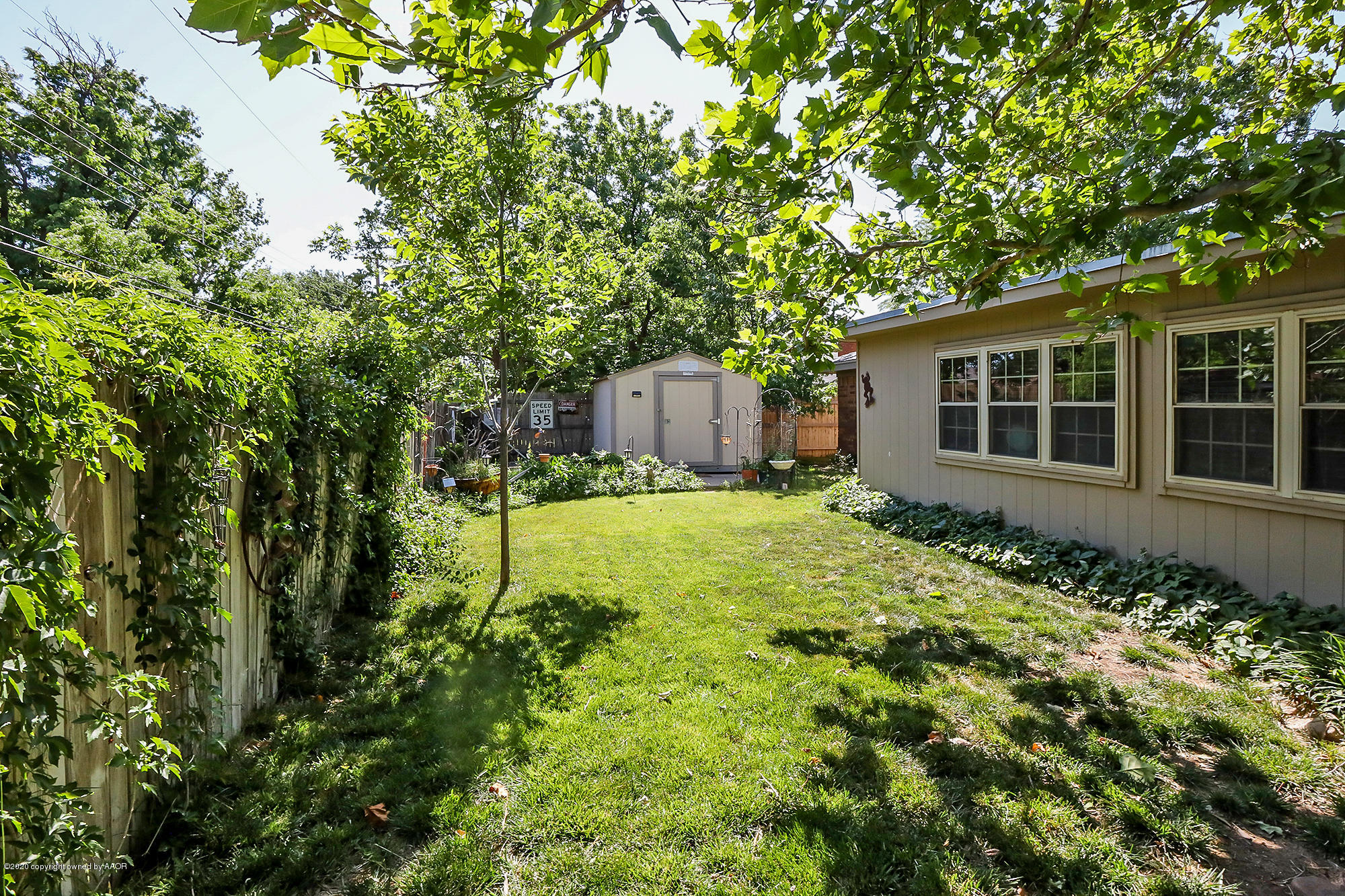 6012 Gainsborough Road Amarillo, TX 79106 - Photo 14 of 15 a house with trees in front of it
