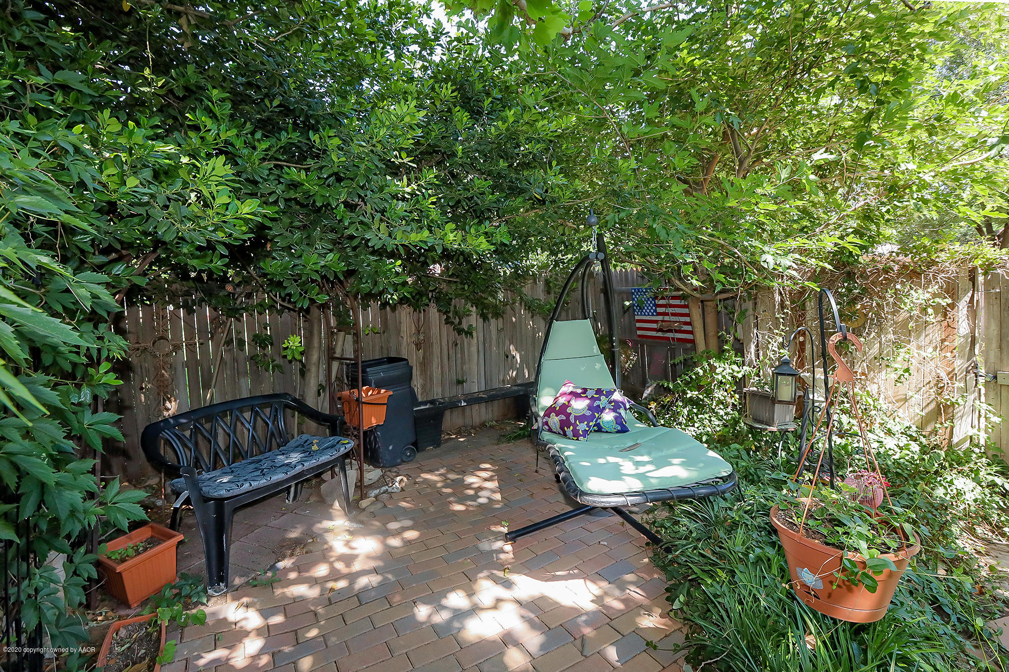 6012 Gainsborough Road Amarillo, TX 79106 - Photo 15 of 15 a backyard of a house with yard and outdoor seating