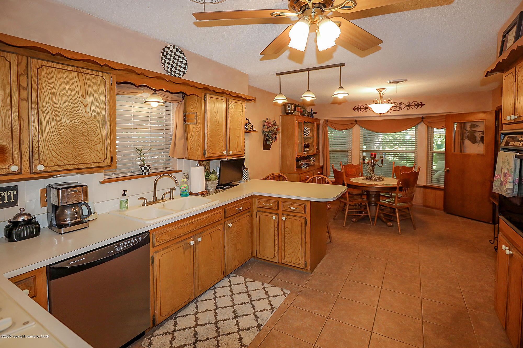 6012 Gainsborough Road Amarillo, TX 79106 - Photo 6 of 15 a large kitchen with a large window