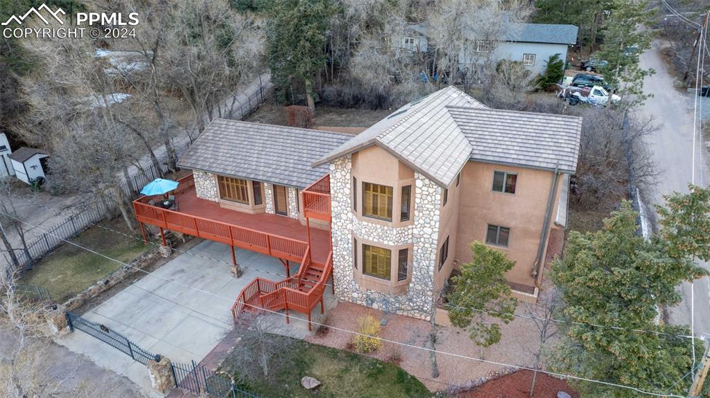 Tucked behind the Broadmoor is this enchanting 3800sf fully fenced & gated property