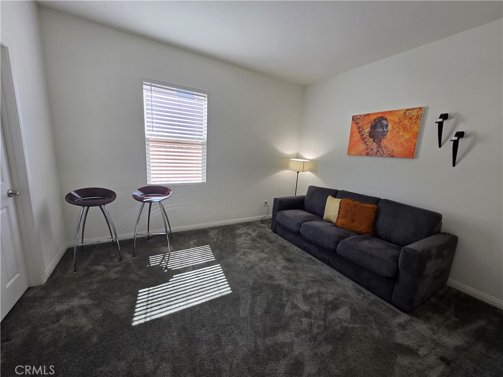 7900 Raincross Court Riverside, CA 92507 - Photo 12 of 21 a living room with furniture and a window