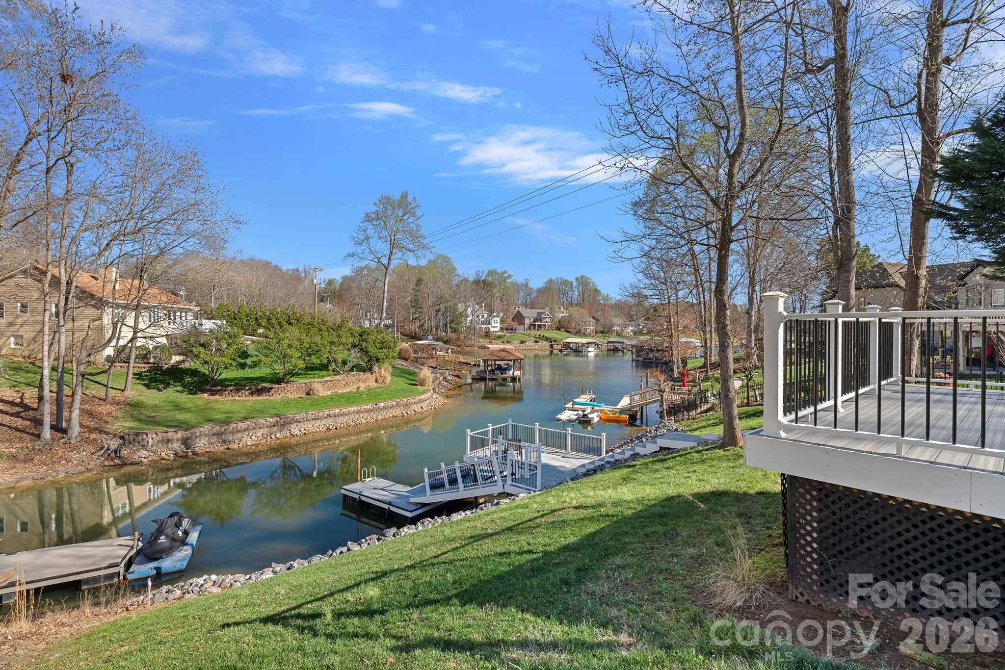 a view of a lake with houses in the back