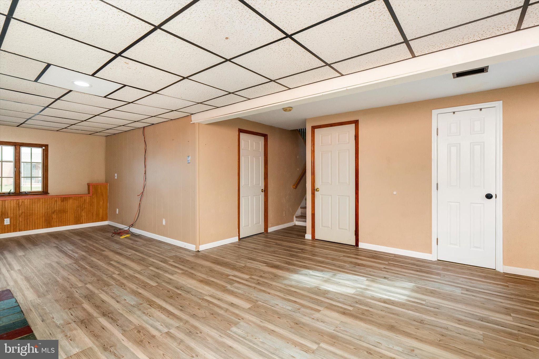 77 Gary Drive Hamilton, NJ 08690 - Photo 16 of 26 a view of an empty room with wooden floor