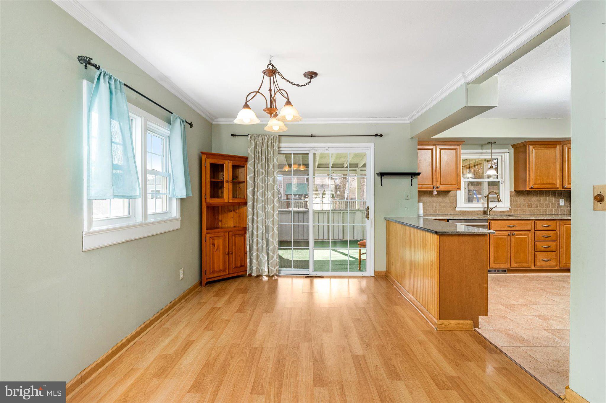 77 Gary Drive Hamilton, NJ 08690 - Photo 5 of 26 a view of a kitchen with wooden floor and outdoor space