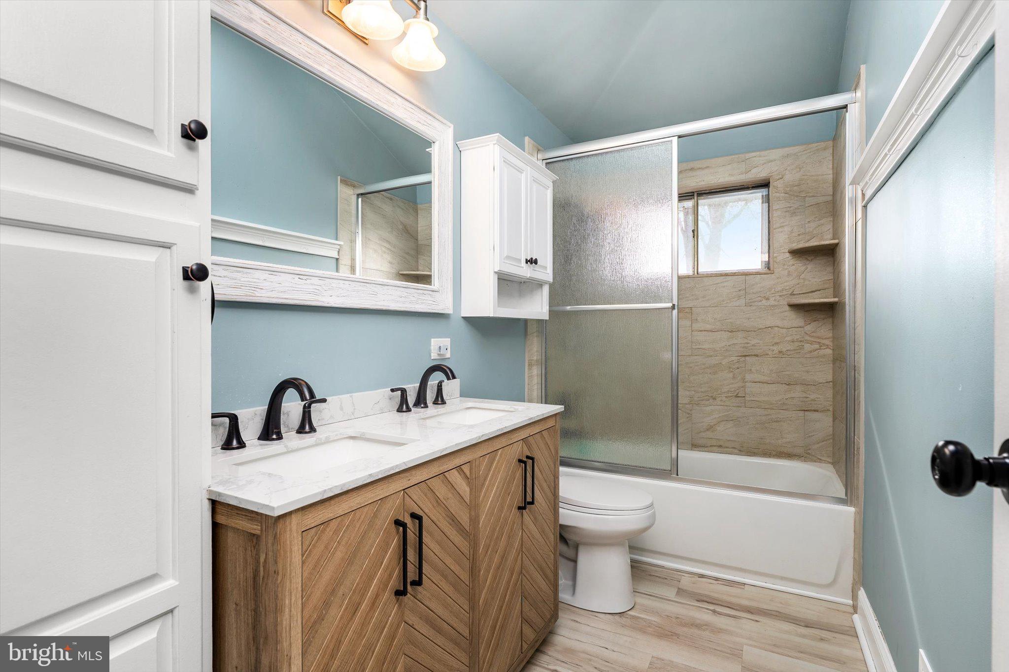 77 Gary Drive Hamilton, NJ 08690 - Photo 10 of 26 a bathroom with a sink a toilet and shower