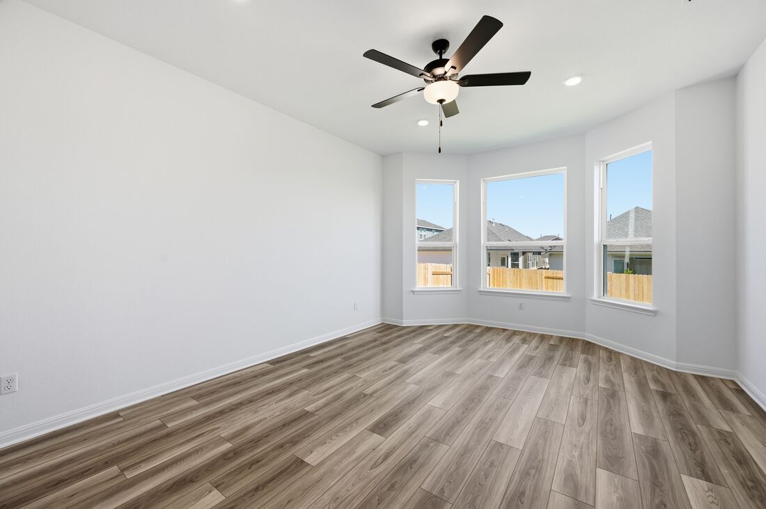 220 Wingstem Way Georgetown, TX 78633 - Photo 8 of 35 wooden floor in an empty room with a window