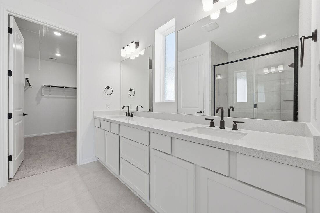 220 Wingstem Way Georgetown, TX 78633 - Photo 10 of 35 a bathroom with double sink and a mirror