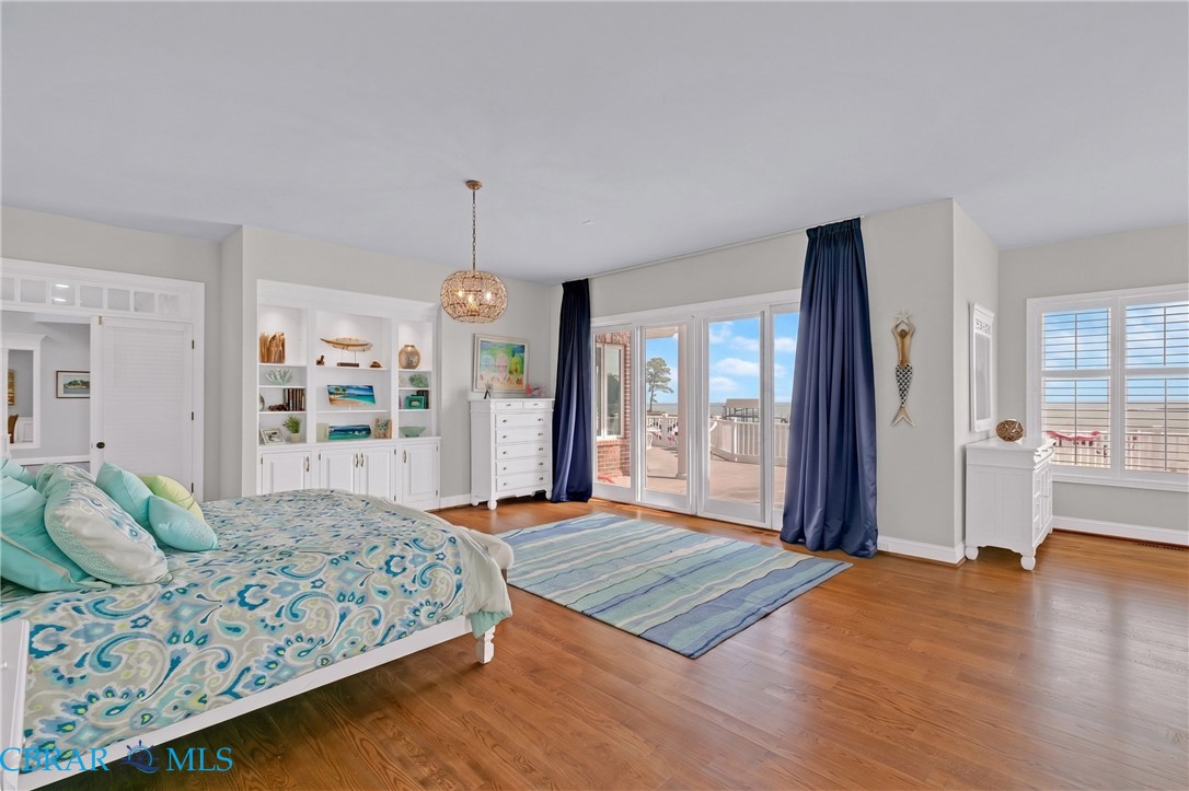 2106 Clarketown Road Heathsville, VA 22473 - Photo 19 of 56 a spacious bedroom with a bed dresser and a window