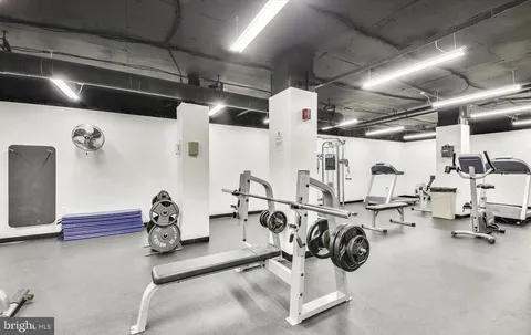a view of swimming pool with outdoor seating and plants