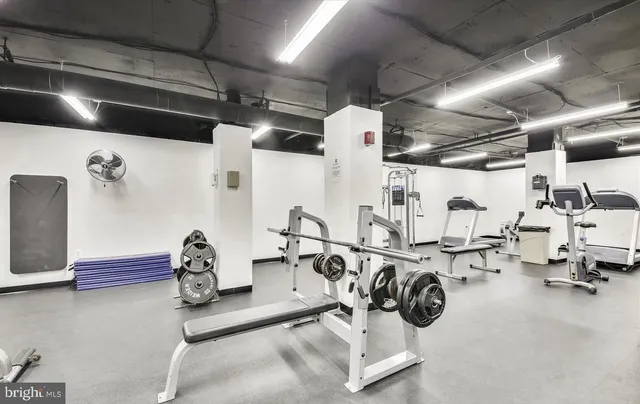 a view of swimming pool with outdoor seating and plants