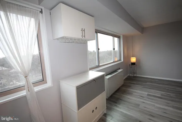 a kitchen with granite countertop a sink a stove and refrigerator