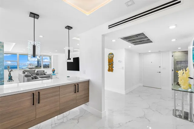 a kitchen with sink and refrigerator