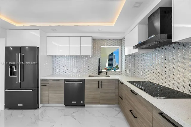 a kitchen with a sink stove and refrigerator