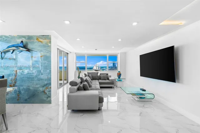 a living room with furniture and a flat screen tv