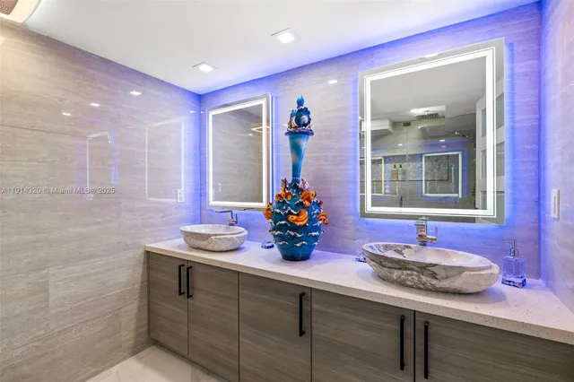 a kitchen with a sink and a wooden floor