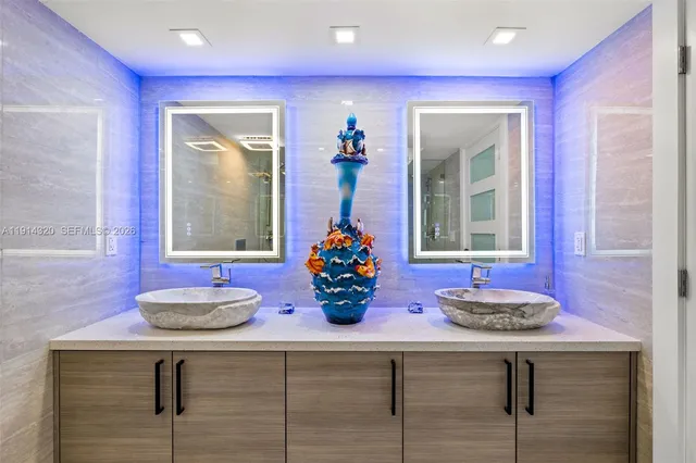 a kitchen with a sink and a wooden floor