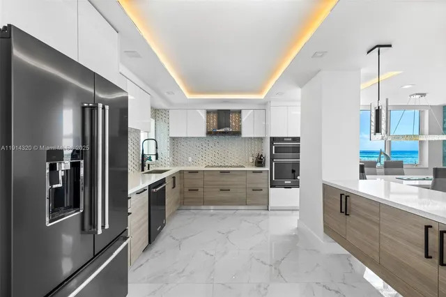 a kitchen with a sink stove and refrigerator