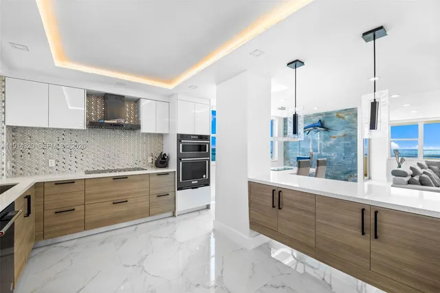 a kitchen with a sink stove and refrigerator