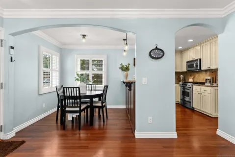 a view of a dining room with furniture window and wooden floor