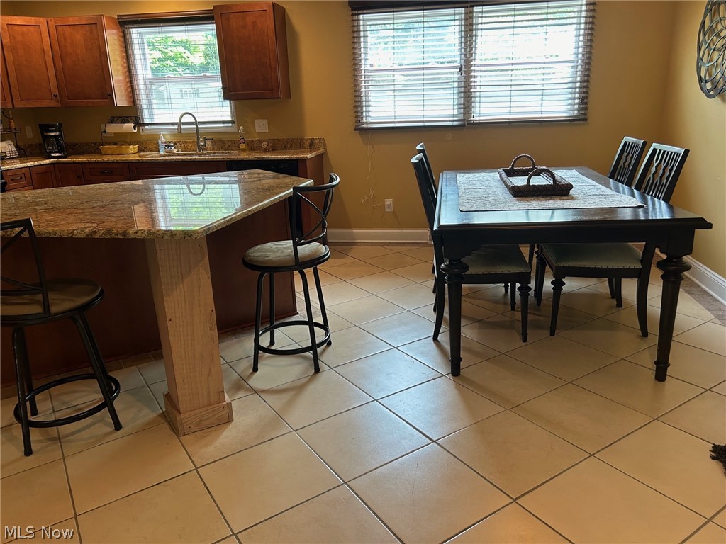 3285 Hemphill Road Barberton, OH 44203 - Photo 3 of 50 Tiled dining space with sink