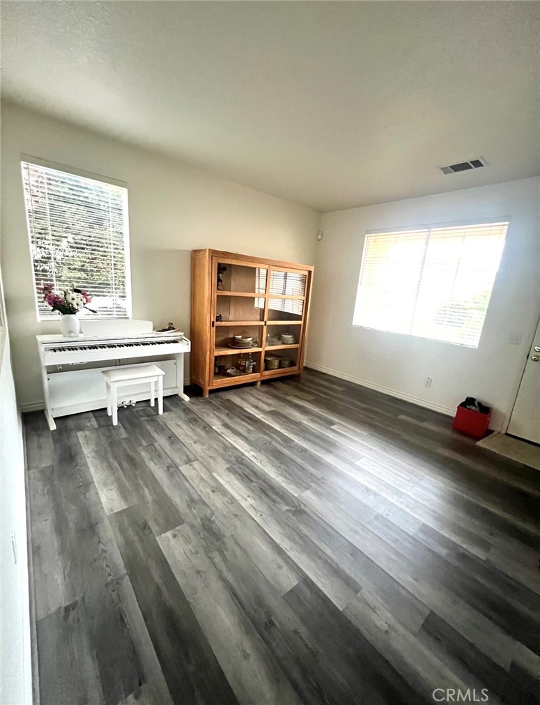 40 Partisan Place Irvine, CA 92602 - Photo 14 of 16 a living room with furniture and a wooden floor