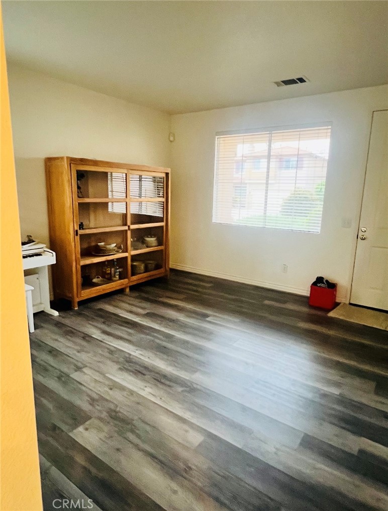 40 Partisan Place Irvine, CA 92602 - Photo 15 of 16 an empty room with wooden floor and window