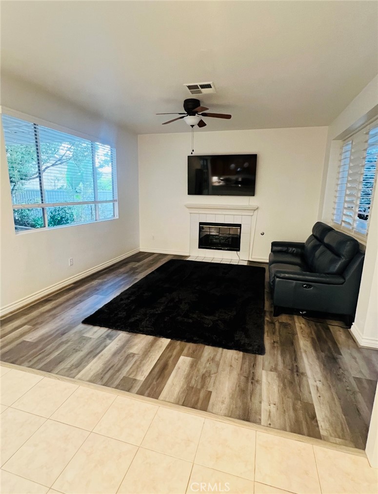 40 Partisan Place Irvine, CA 92602 - Photo 9 of 16 a living room with a couch and a fireplace
