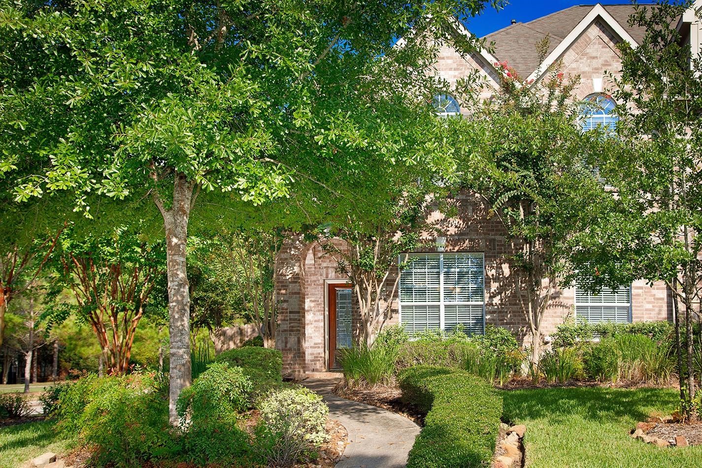 3 Pine Needle Place The Woodlands, TX 77382 - Photo 1 of 19 front view of a house with a tree