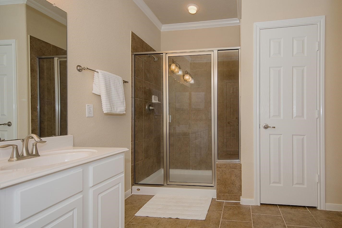 3 Pine Needle Place The Woodlands, TX 77382 - Photo 12 of 19 a bathroom with a shower and a sink