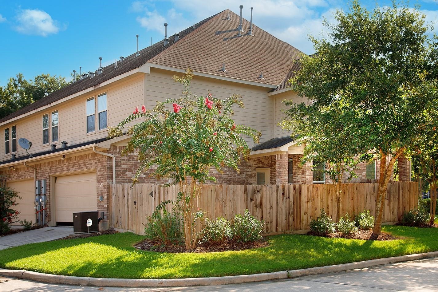 3 Pine Needle Place The Woodlands, TX 77382 - Photo 18 of 19 a front view of a house with a yard and garage