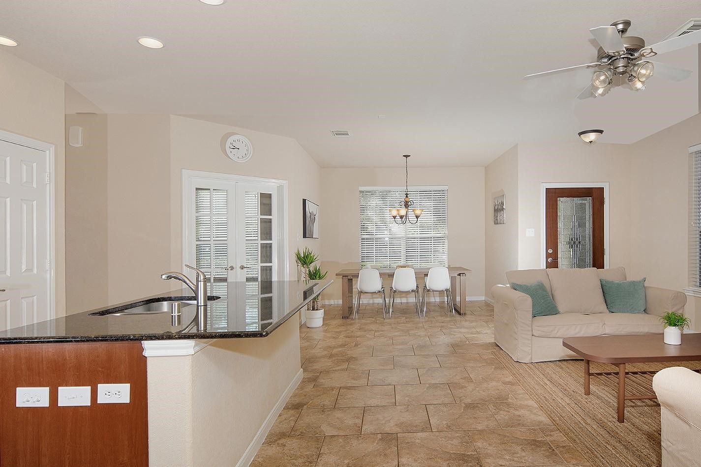 3 Pine Needle Place The Woodlands, TX 77382 - Photo 5 of 19 a living room with furniture and a chandelier