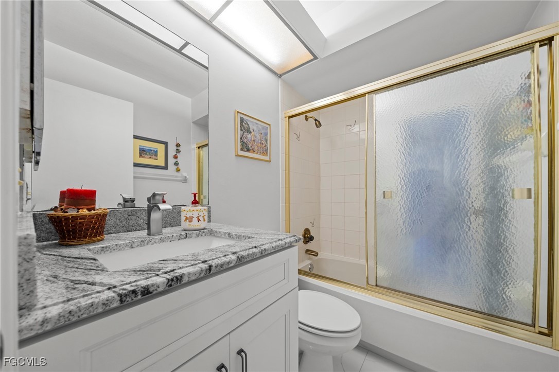 11650 Pointe Circle Fort Myers, FL 33908 - Photo 17 of 40 a bathroom with a granite countertop sink toilet and shower