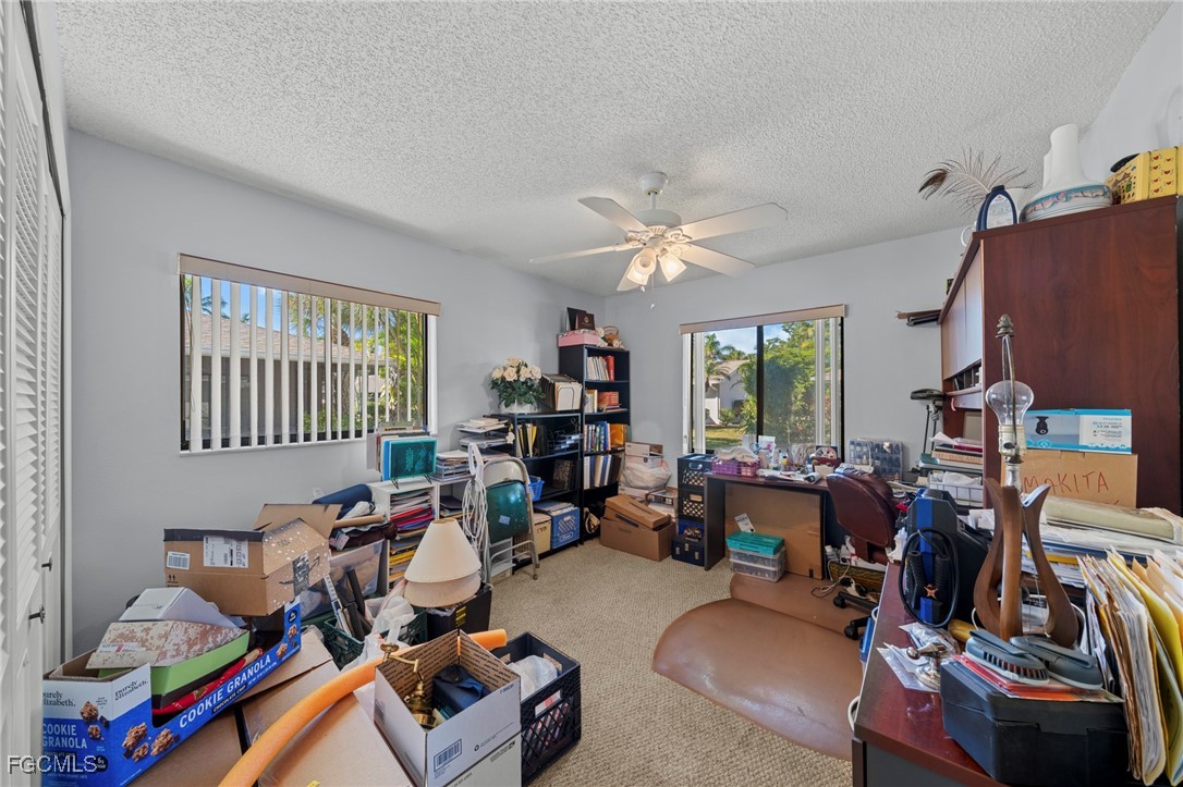 11650 Pointe Circle Fort Myers, FL 33908 - Photo 18 of 40 a room with furniture a chandelier and a window