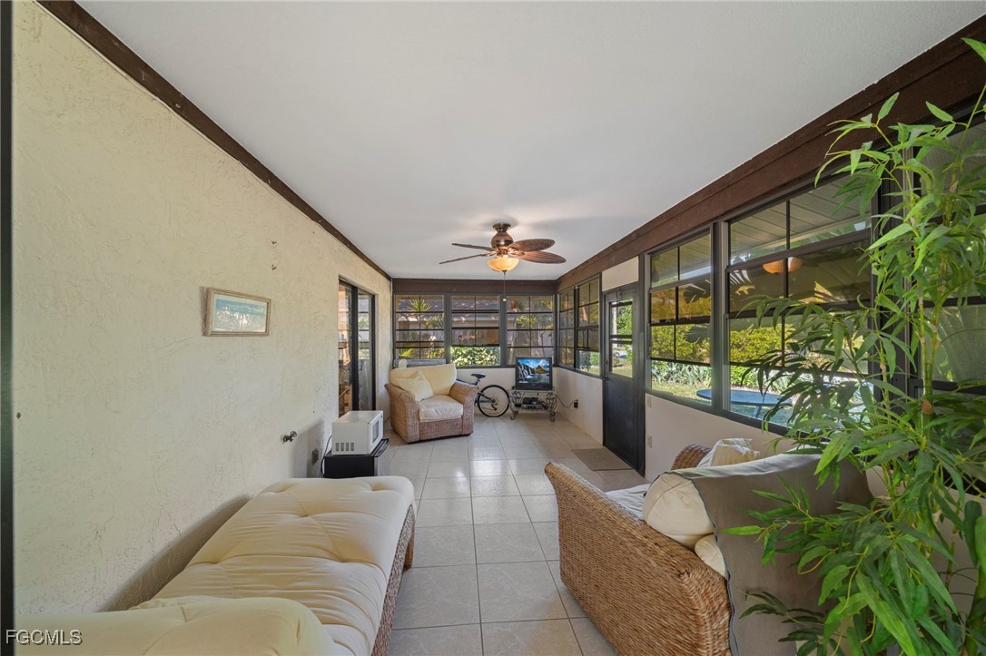 11650 Pointe Circle Fort Myers, FL 33908 - Photo 19 of 40 a living room with furniture and a large window