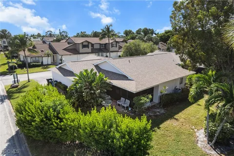 a front view of house with a garden and patio